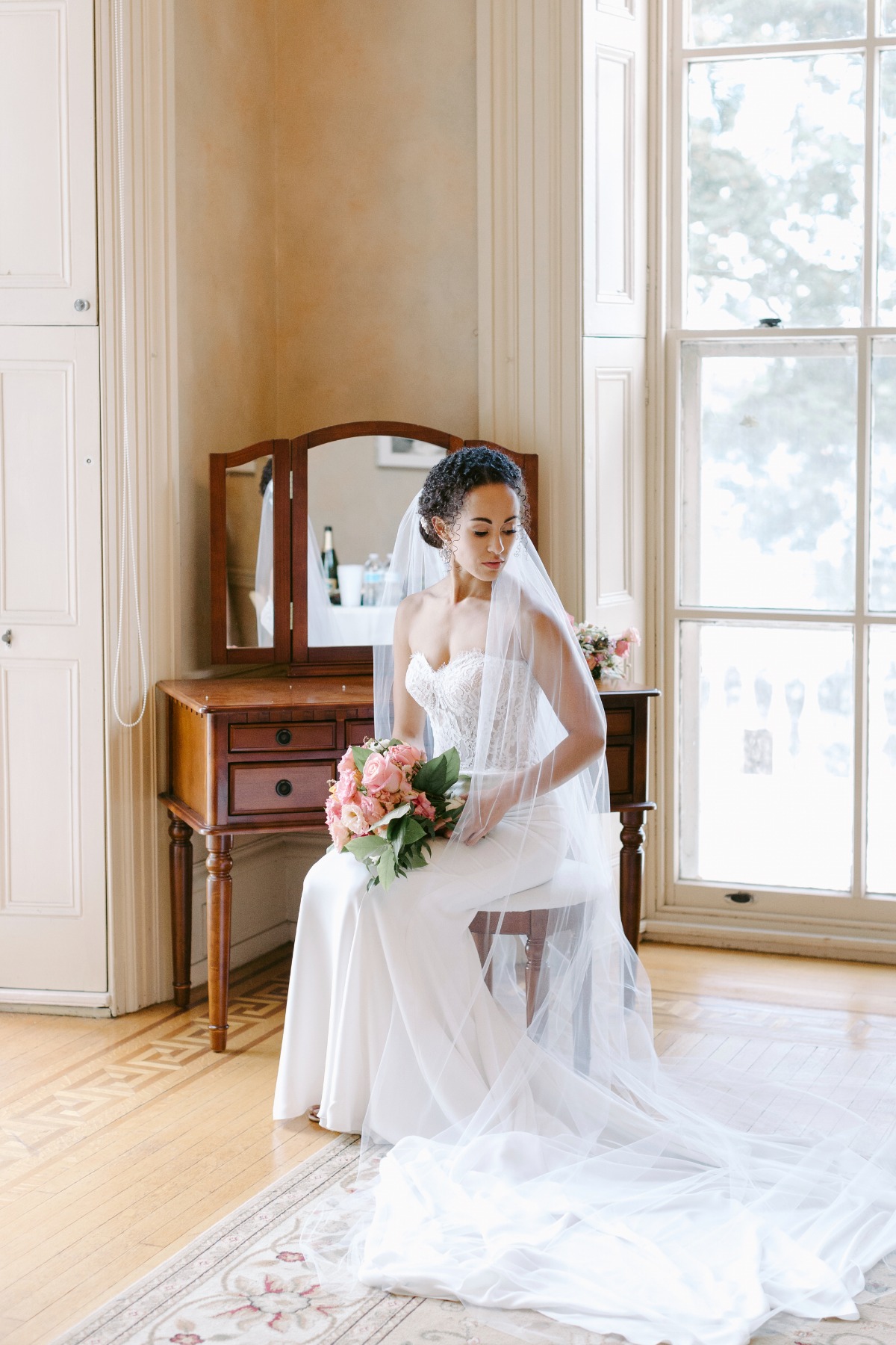 Bridal portrait seated with veil