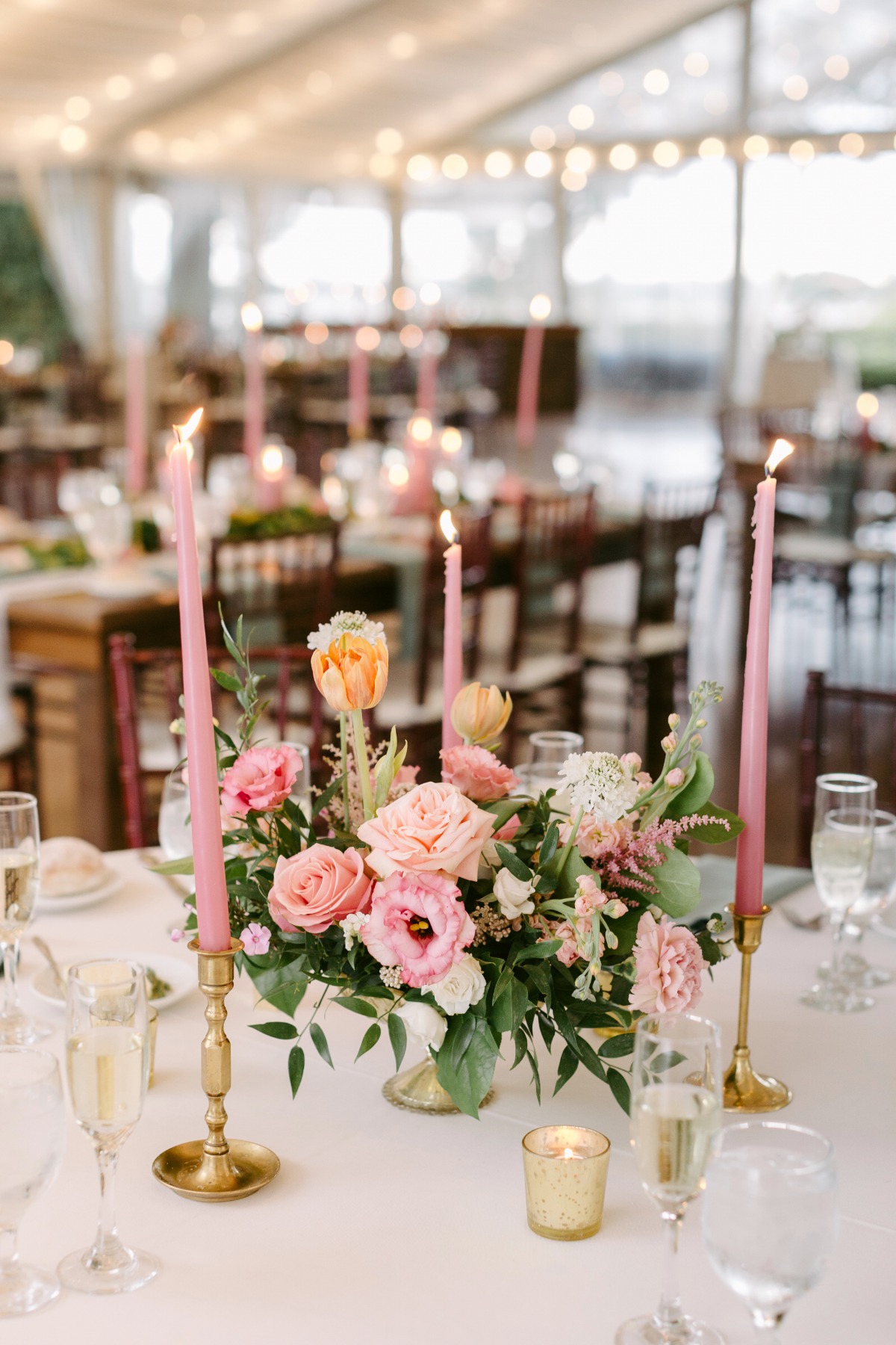 Reception table centerpiece with pink candles