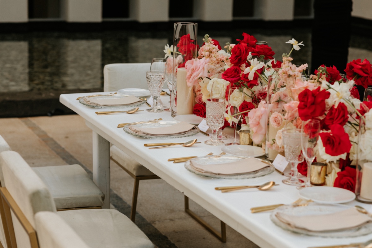 Tablescape with red, pink, and white flowers
