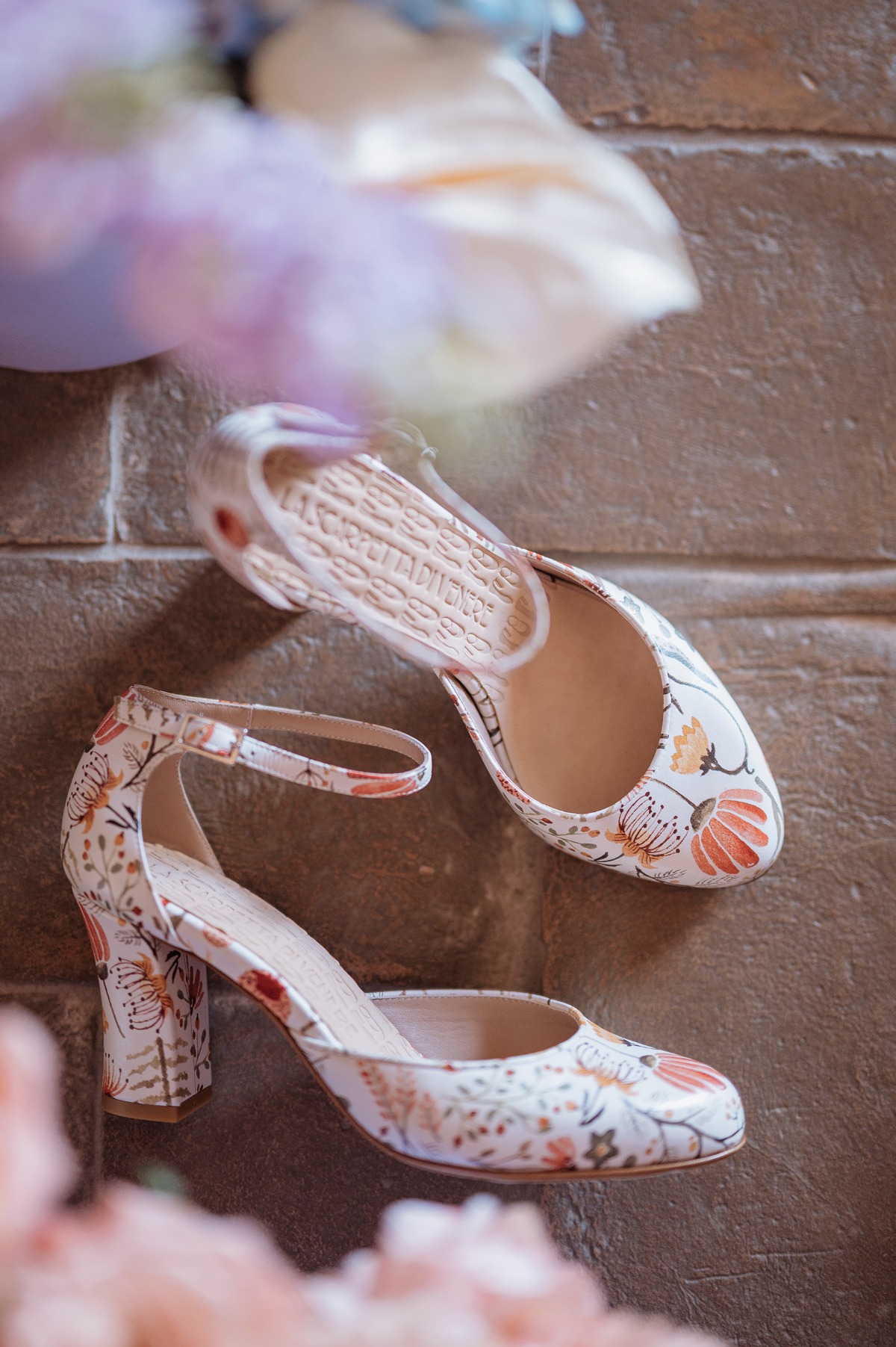 Aerial view of floral bridal shoes