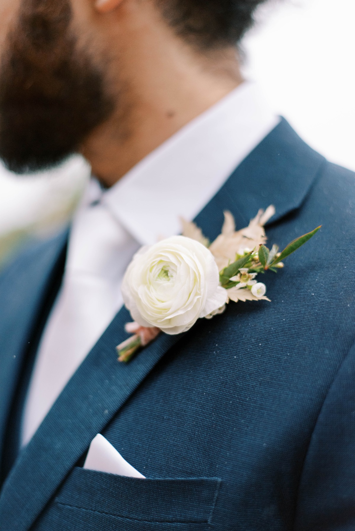 Close-up of groom's boutonniere