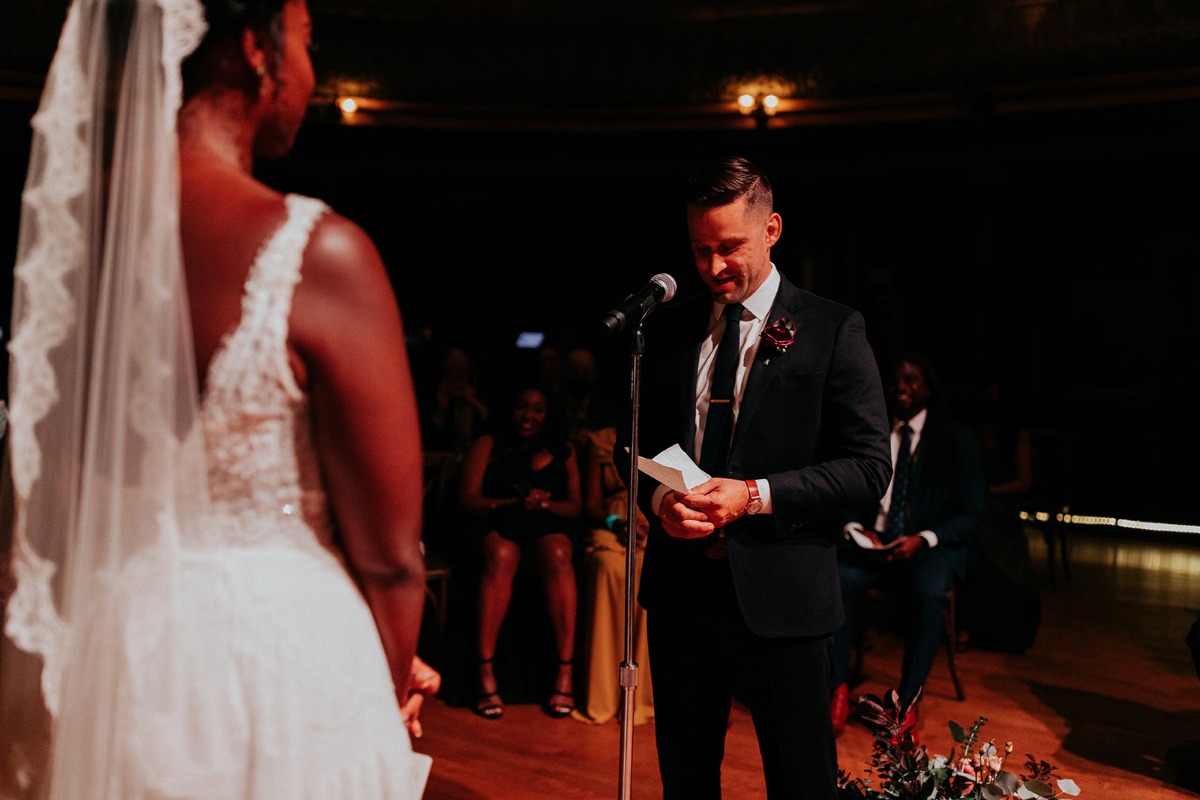 Groom reading vows during ceremony