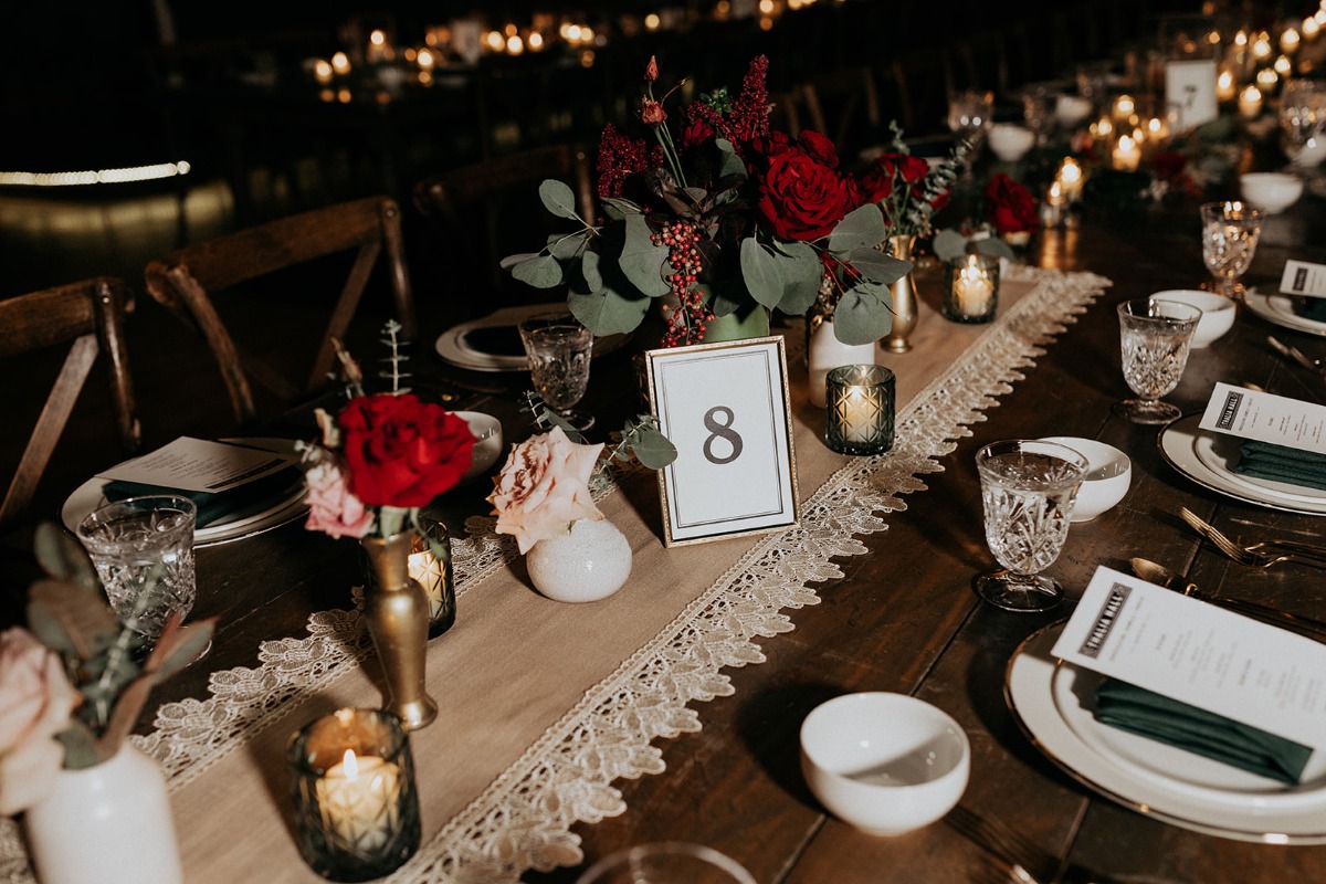 Tablescape with table number, place settings, and flowers
