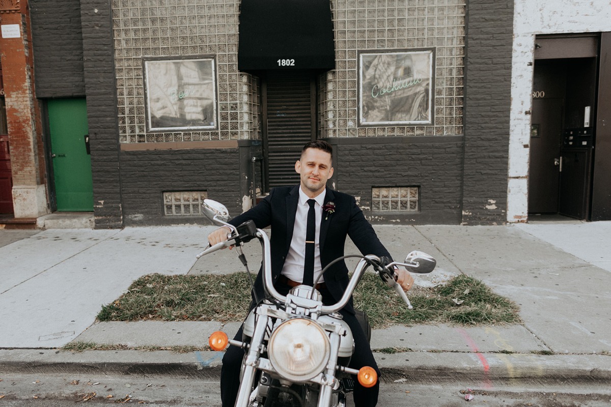 Portrait of groom on motorcycle