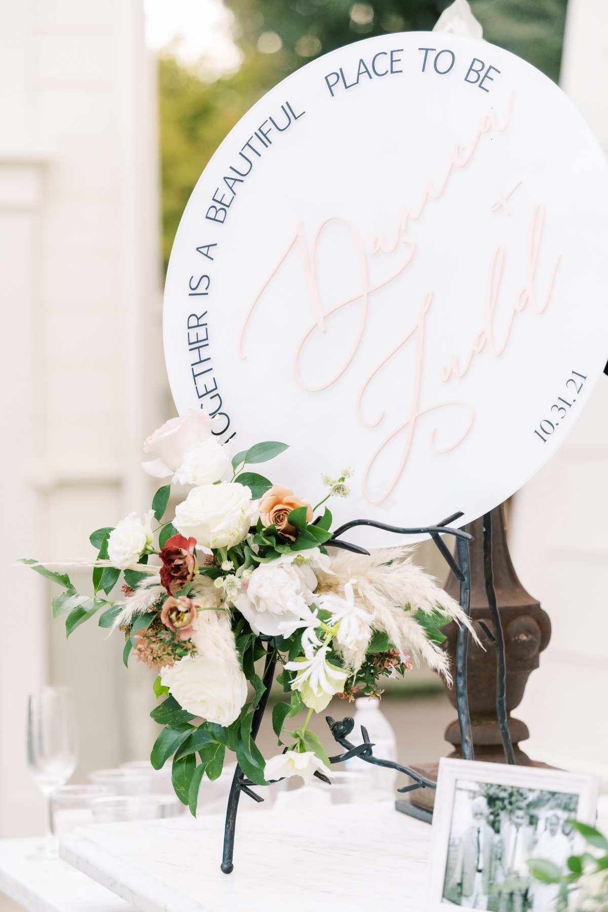 Reception table floral arrangement and sign
