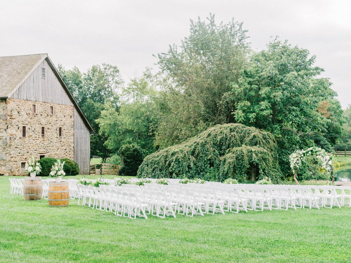 Ceremony set-up with white chairs