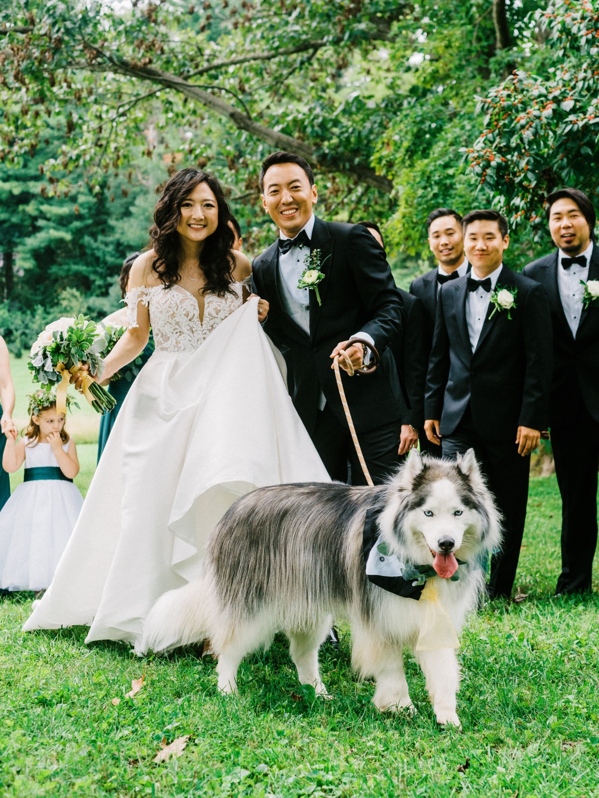 Portrait of bride and groom with dog
