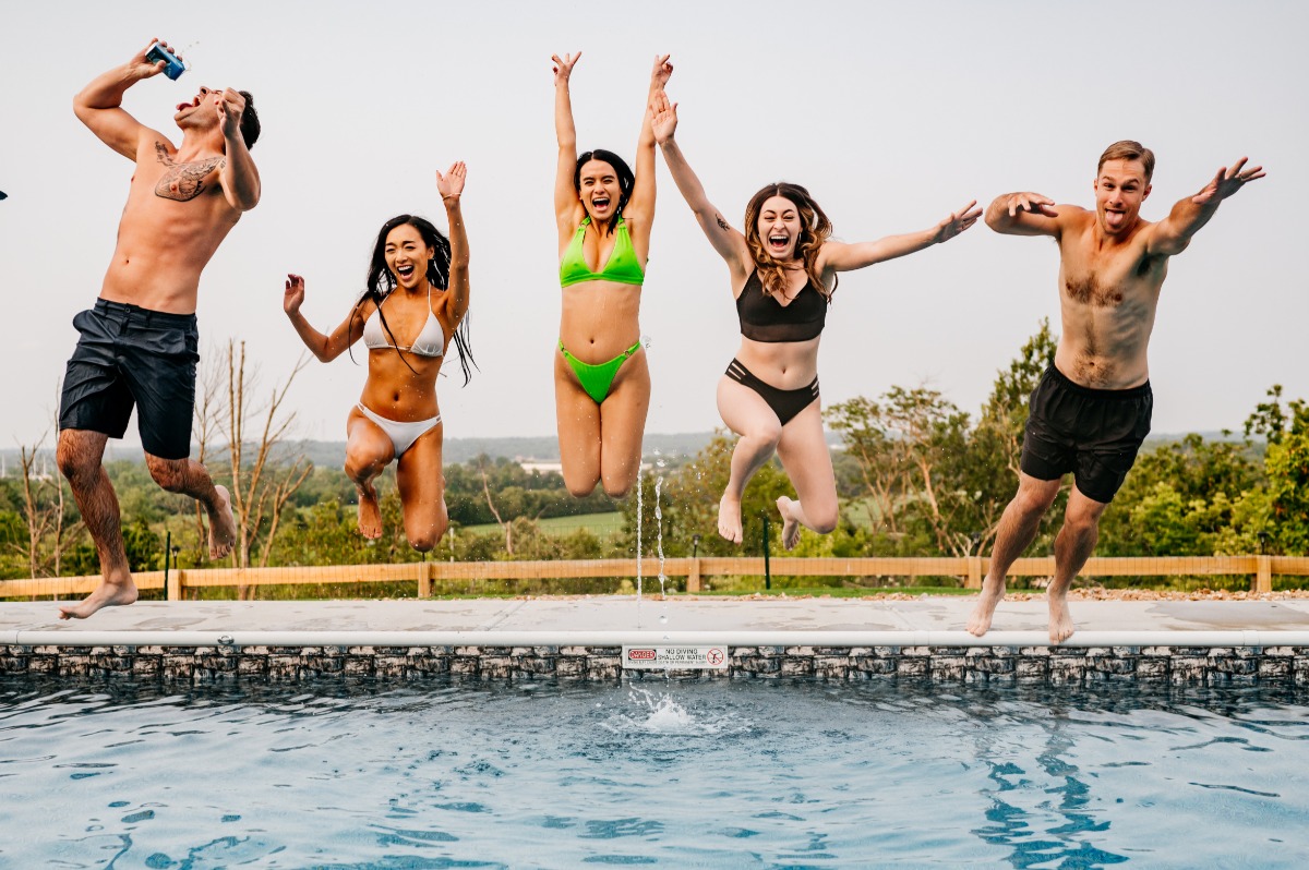 Group jumping into the pool
