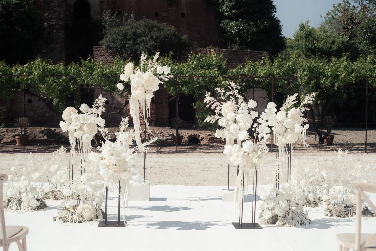 Ceremony altar space with tall white floral arrangements