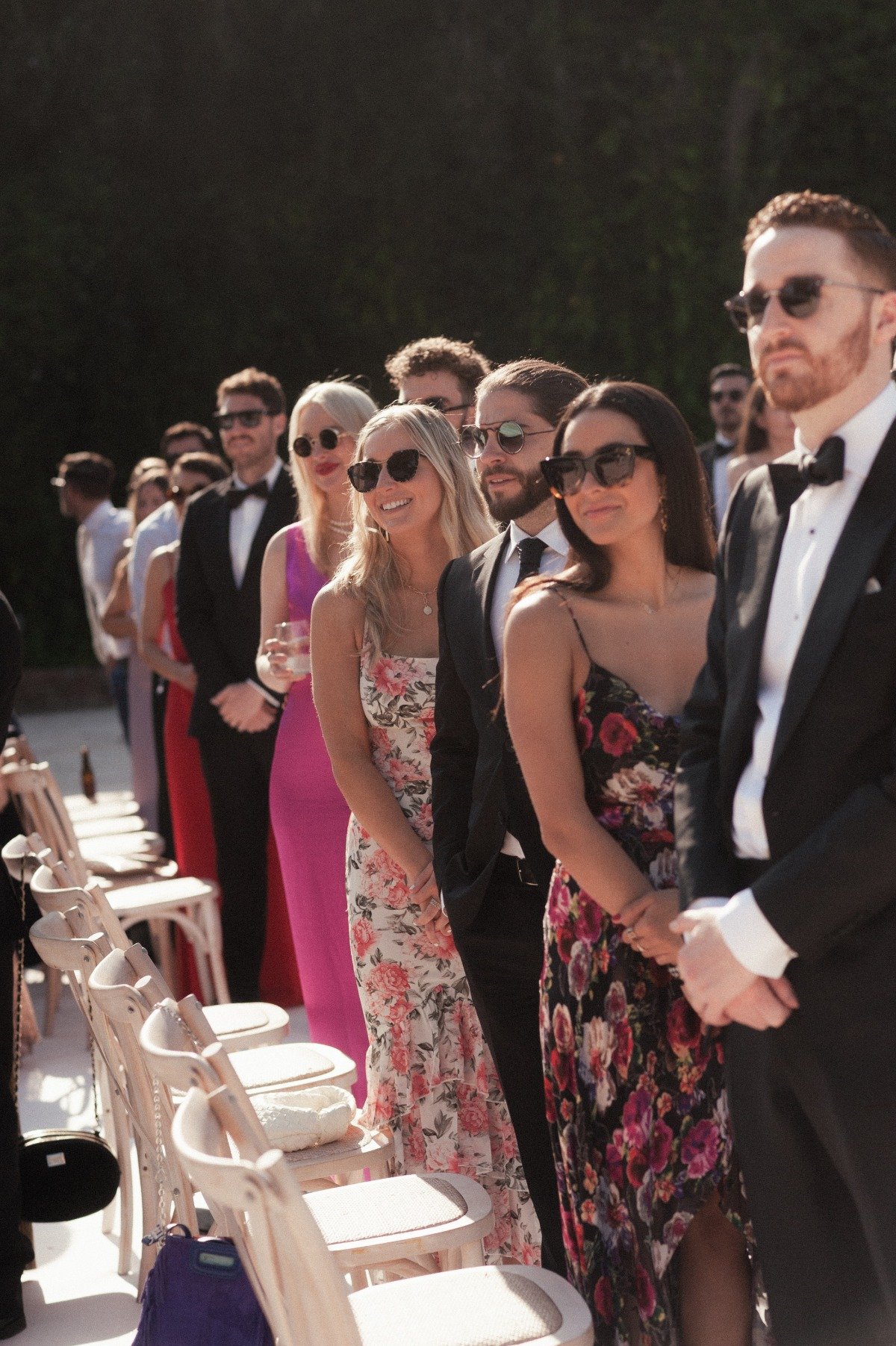 Guests standing in sunglasses
