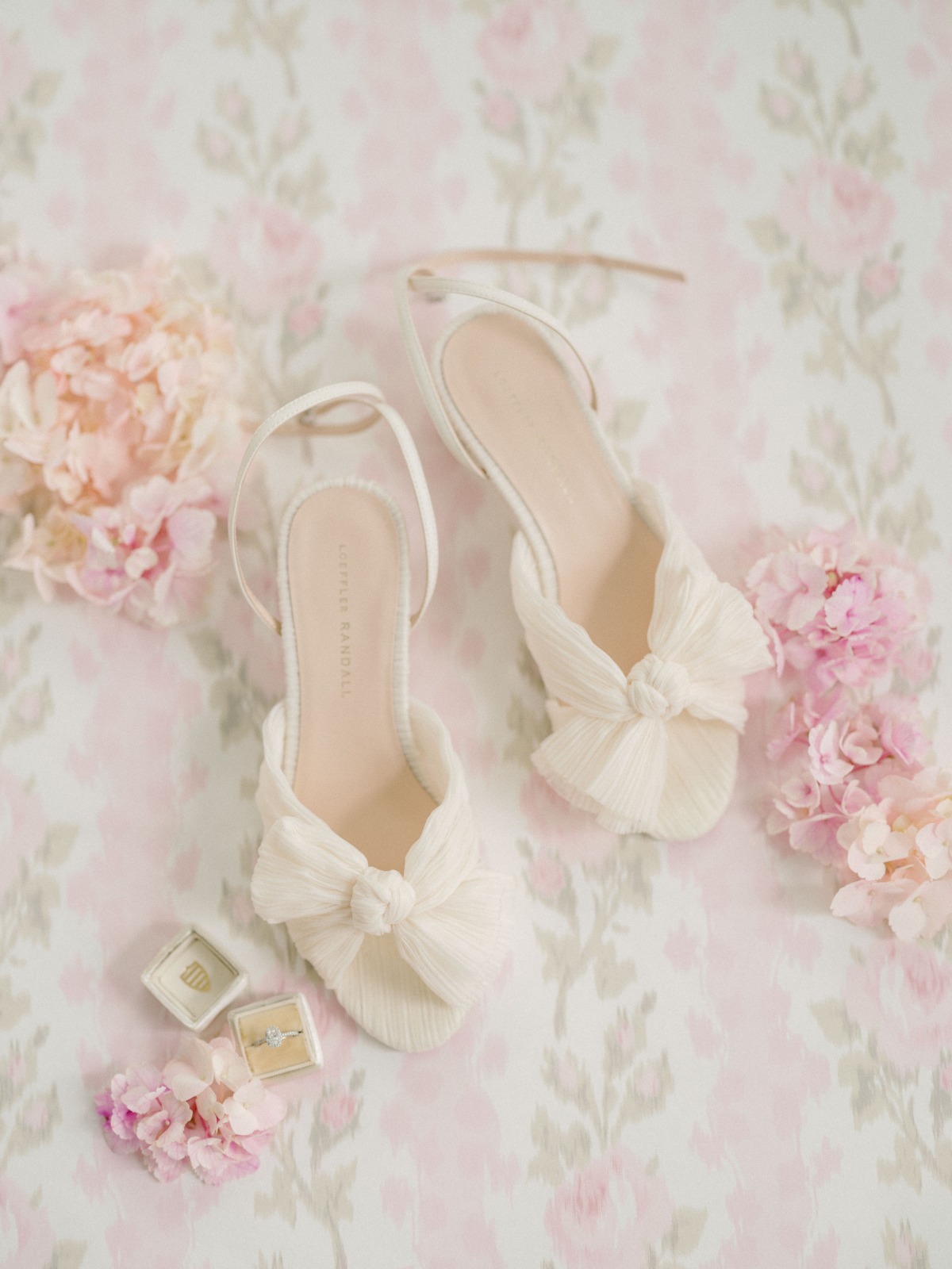 Aerial photo of bride's wedding shoes and jewelry