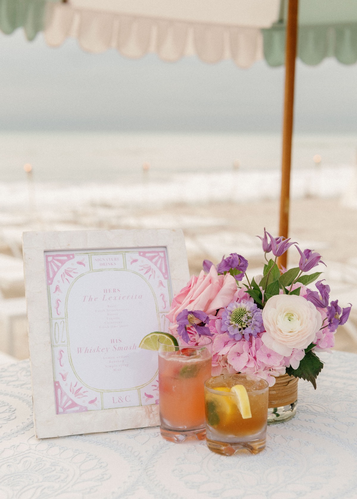 Reception beverage menu with centerpiece and two cocktails