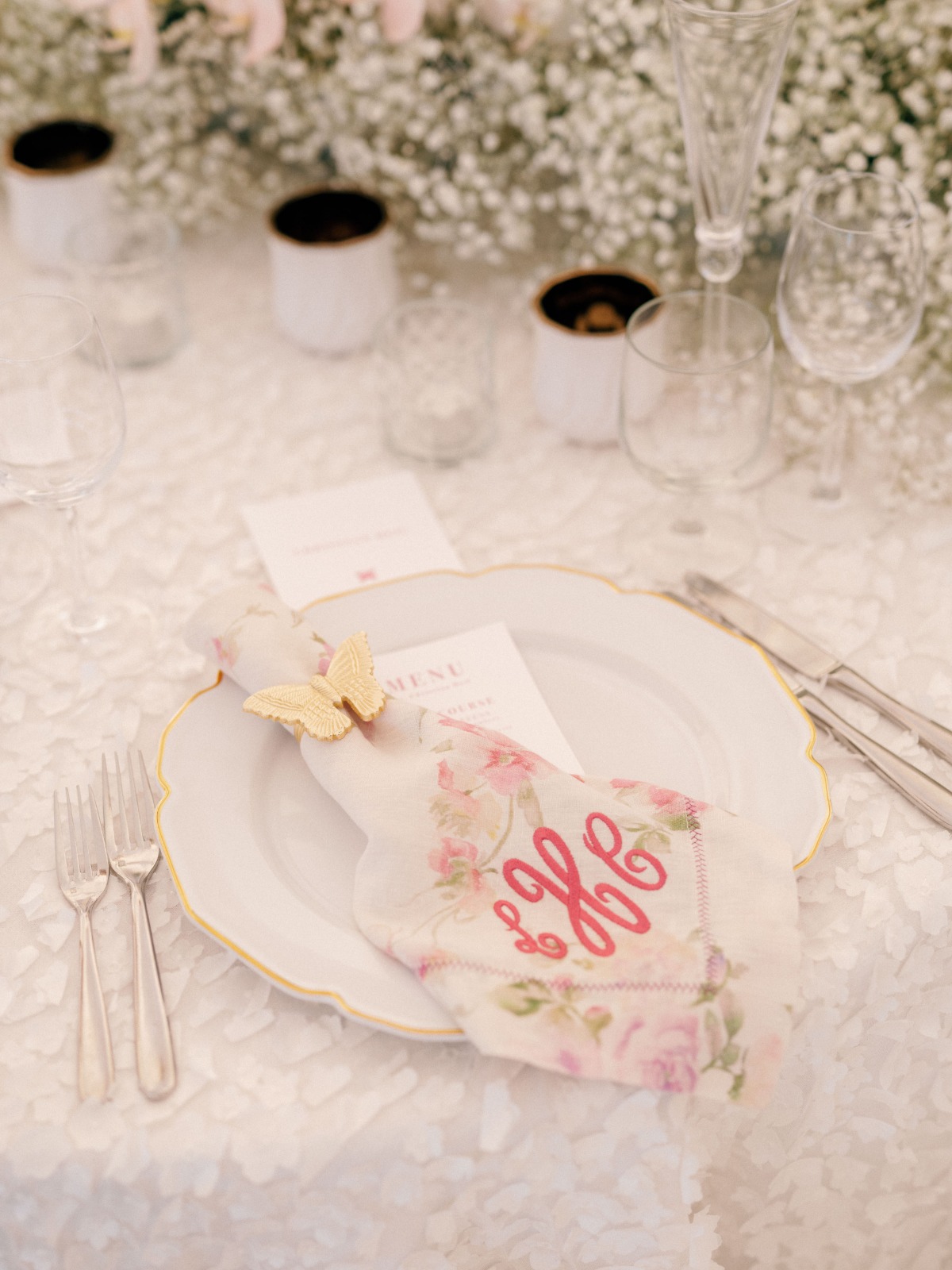Reception place setting with butterfly napkin holder and monogrammed napkin