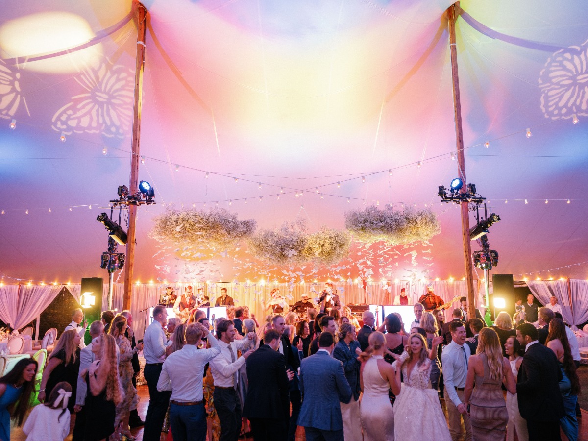 Panoramic photo of guests dancing at reception