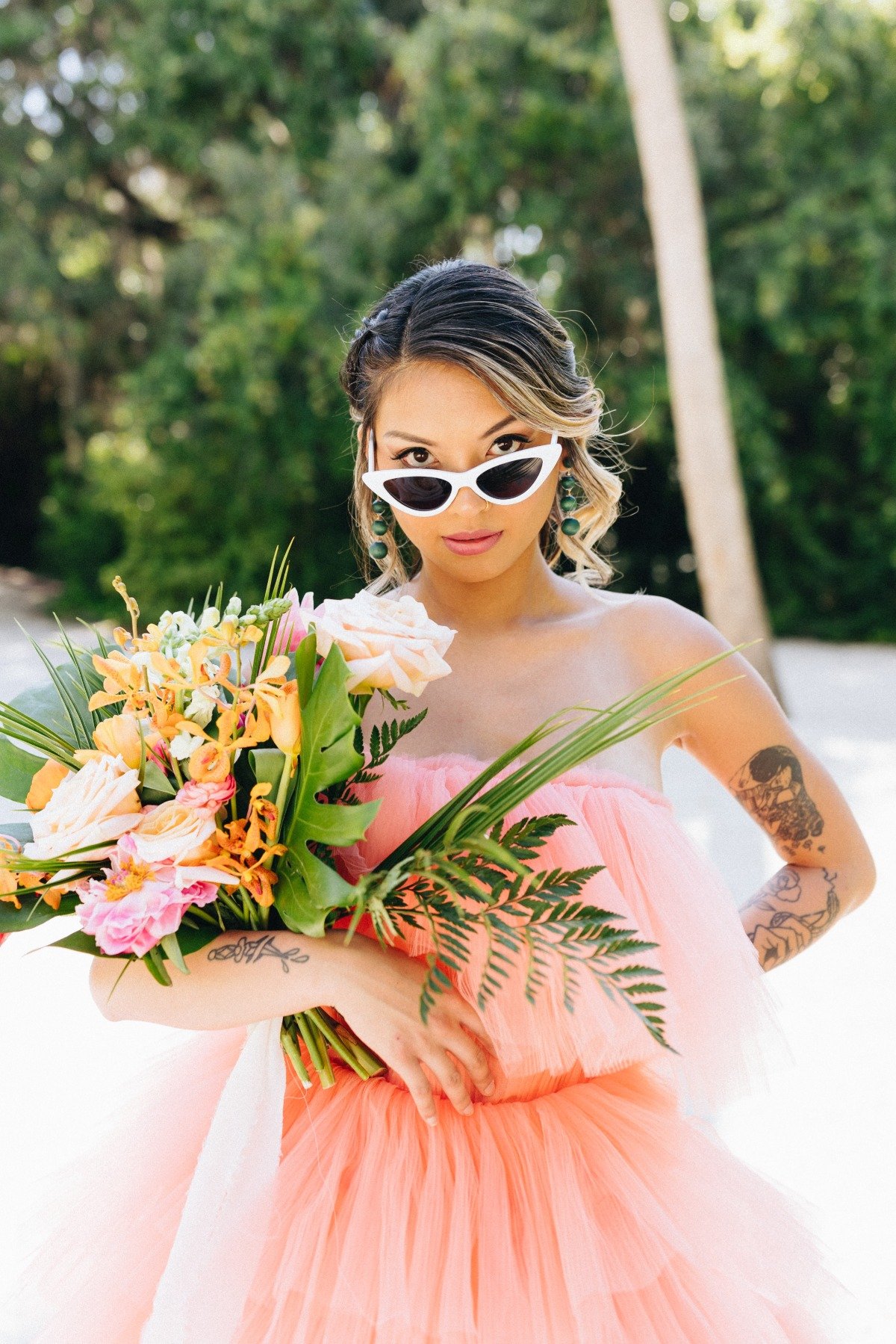 Bridal portrait with bouquet wearing sunglasses