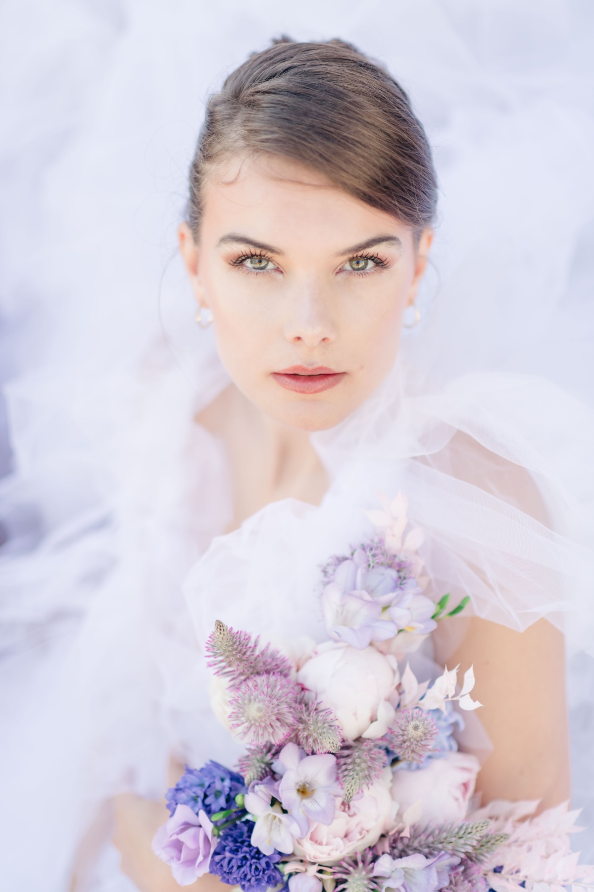 Portrait of bride surrounded by tulle