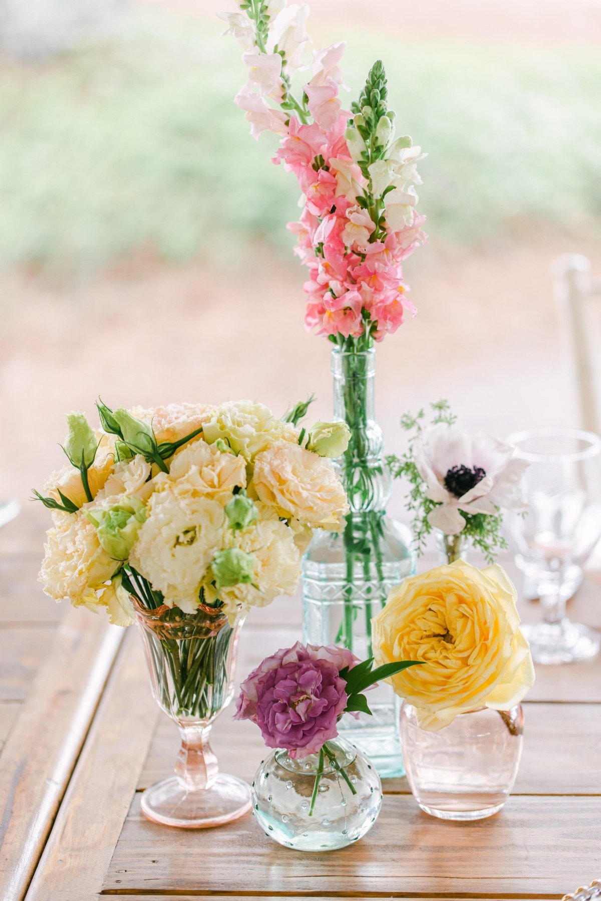 Spring flowers in vintage colorful vases