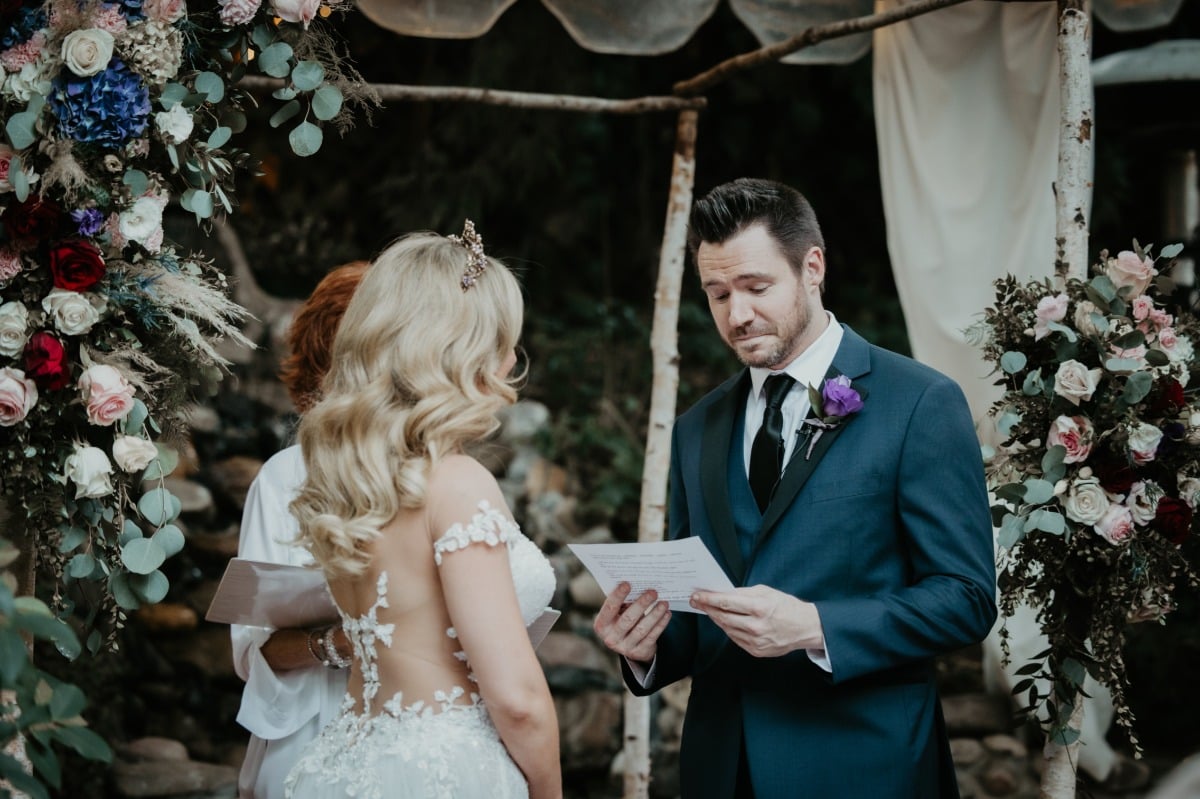 Groom reading vows at ceremony
