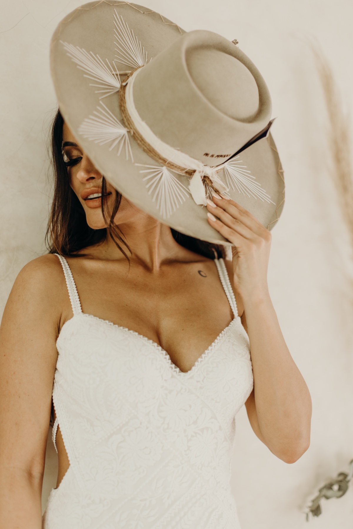 Bridal portrait with flat-brimmed hat