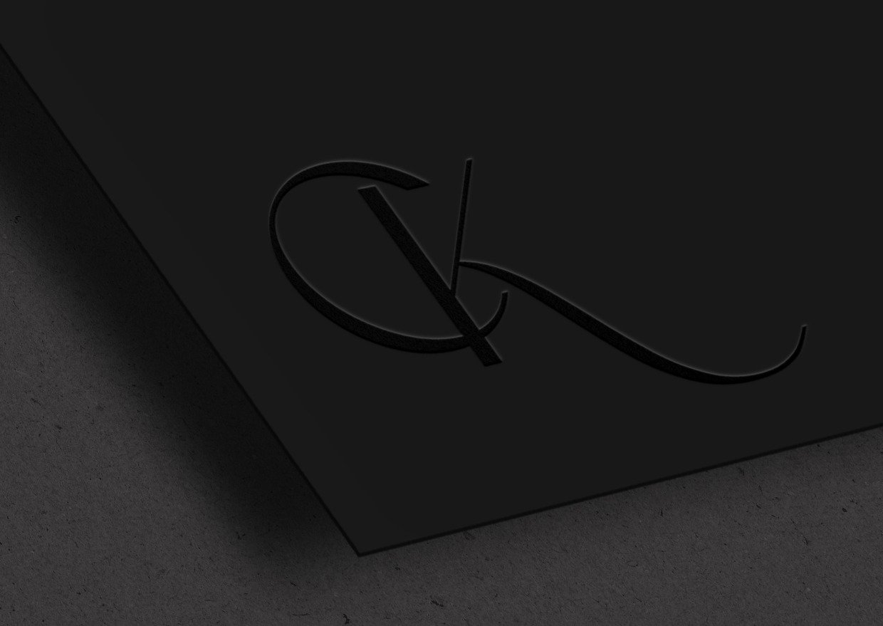 CK Monogram Design in Blind Deboss on black card by DesigningLove.co