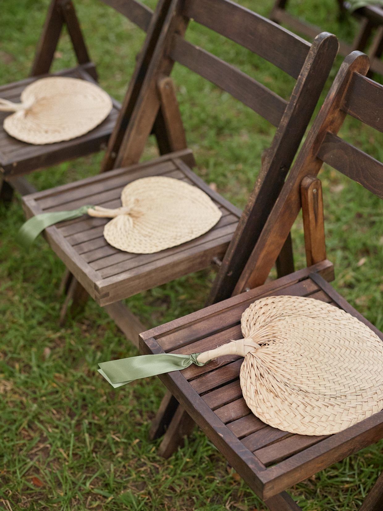 Rattan fans on ceremony chairs
