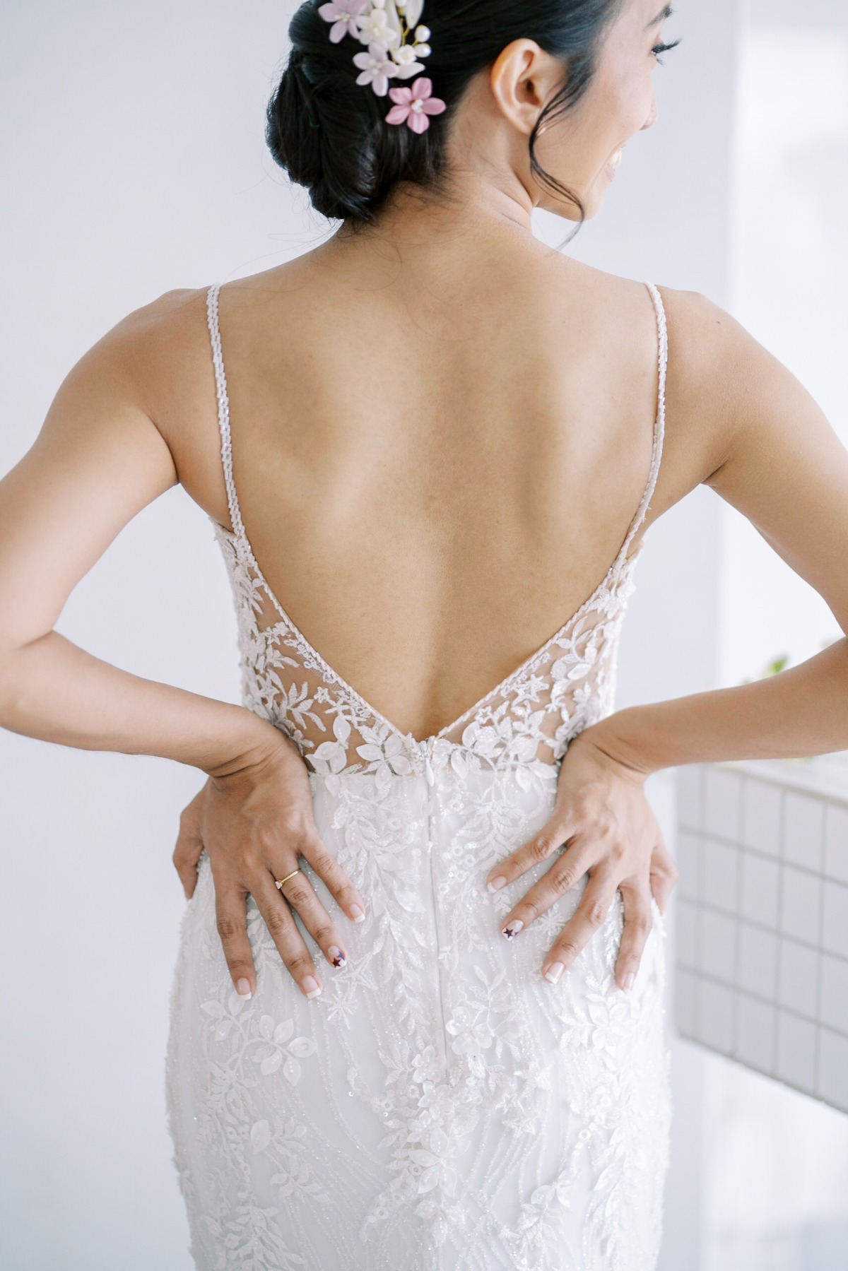 Portrait of back of bride's dress and hairpiece
