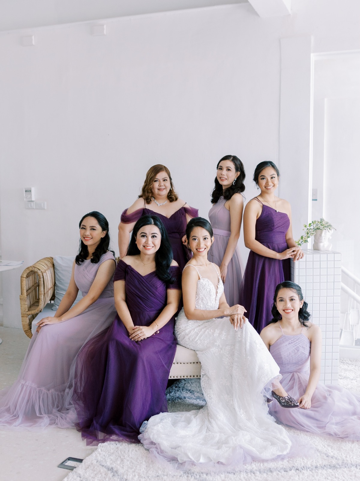 Bride and Bridesmaids in varying purple dresses
