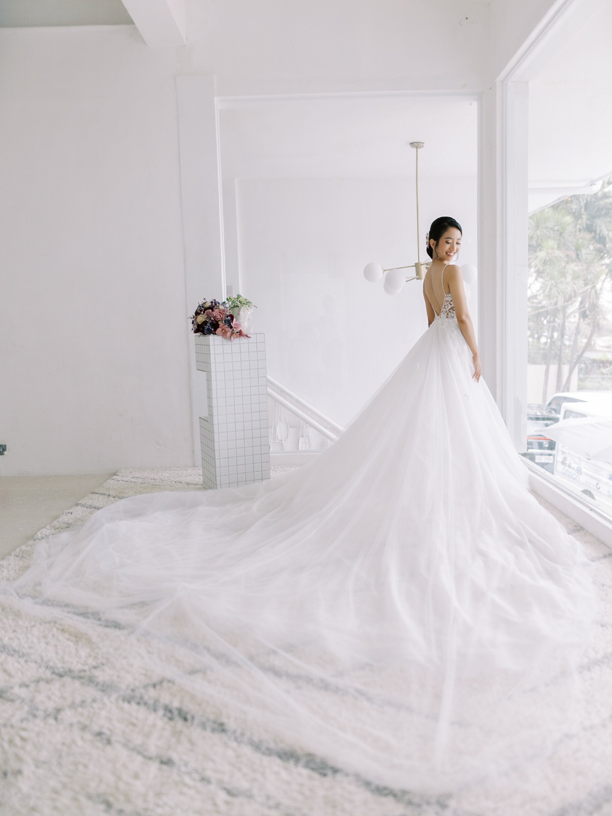 Portrait of cathedral tulle train on bride's dress
