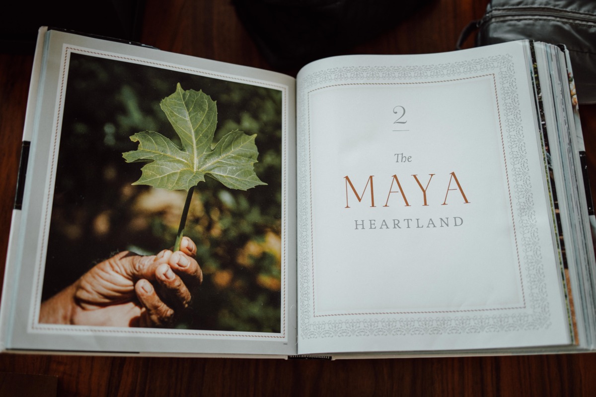 Book open to a page reading Maya Heartland
