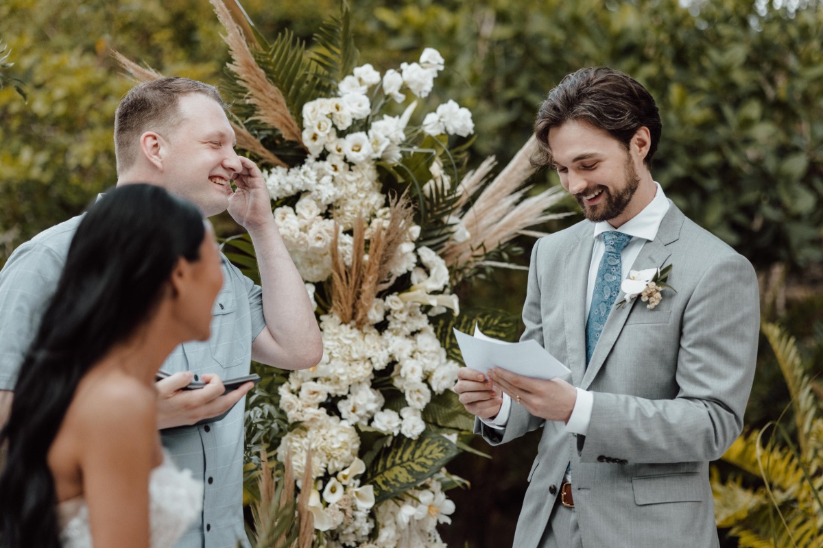Groom reading vows to bride during ceremony