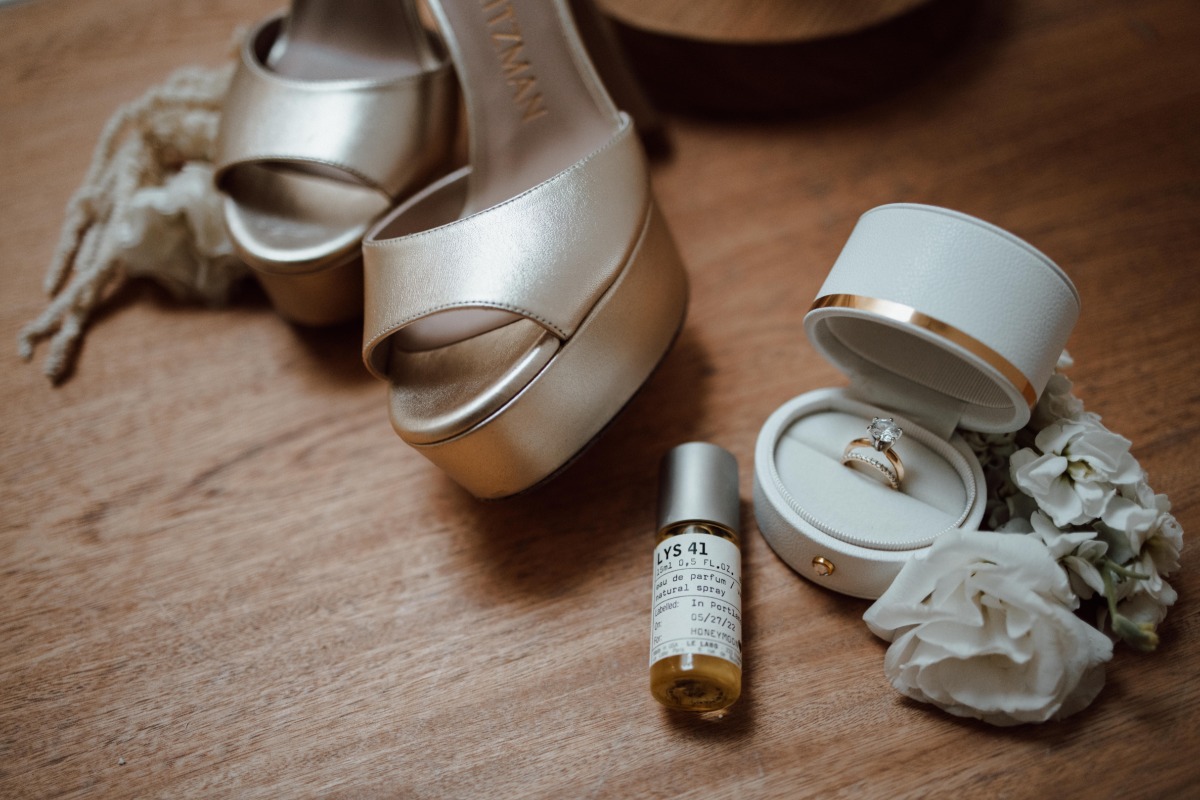 Wedding shoes, perfume, and rings