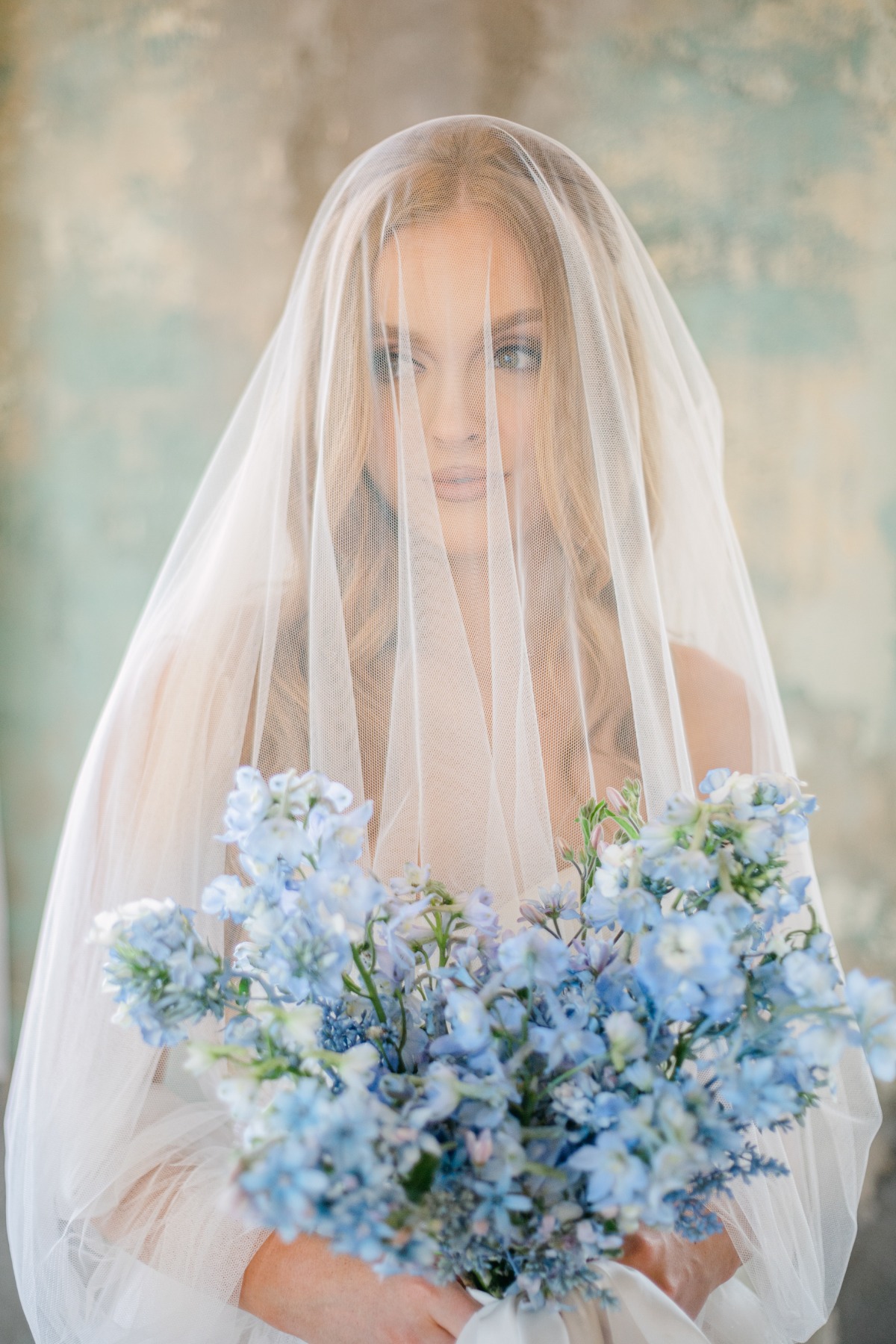 bridal portrait with blue bridal bouquet