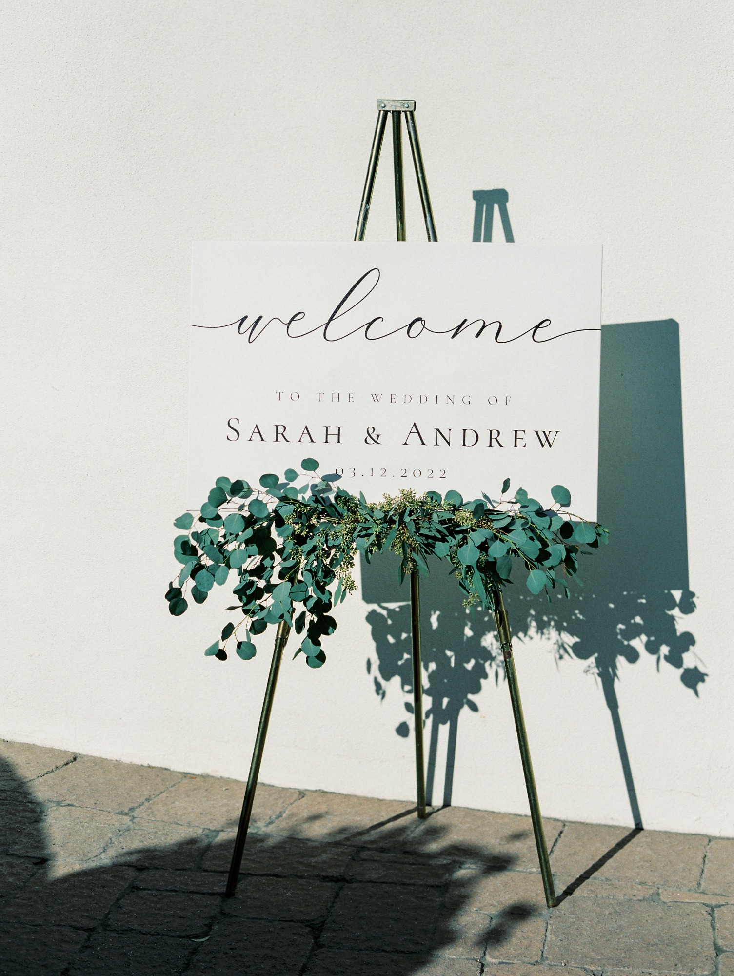 welcome wedding sign with eucalyptus leaves