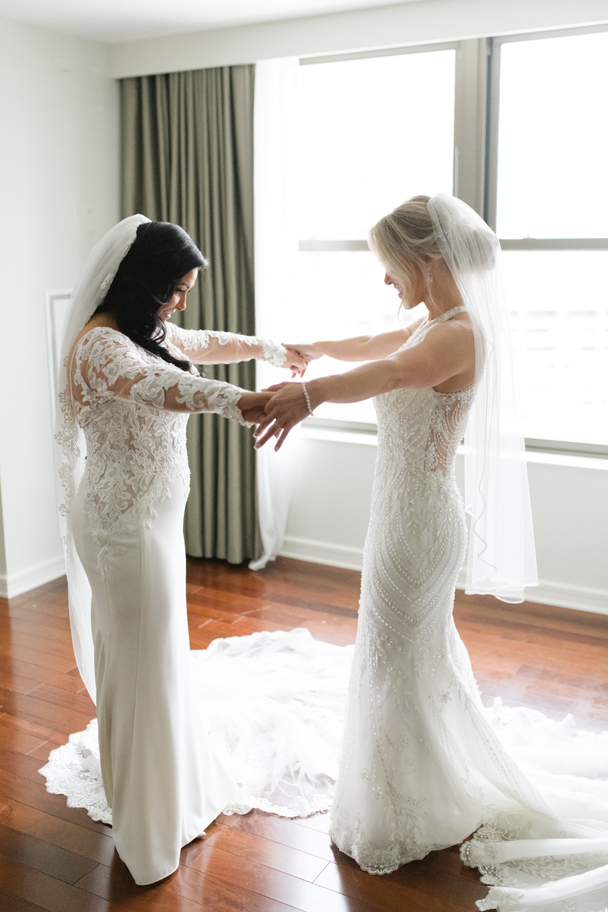 Brides' first look holding hands