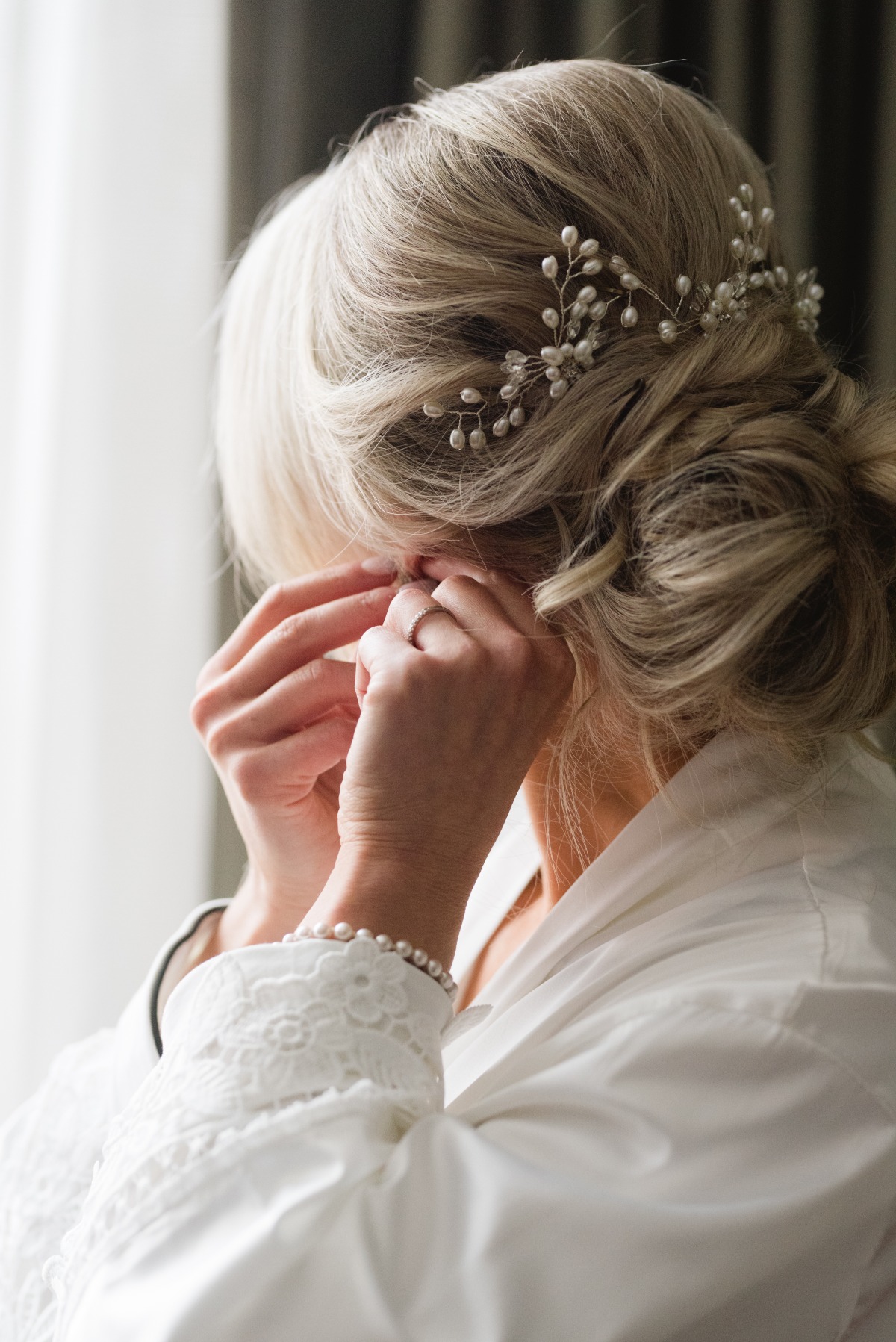 Portrait of bride's wedding hair with pearl hairpiece