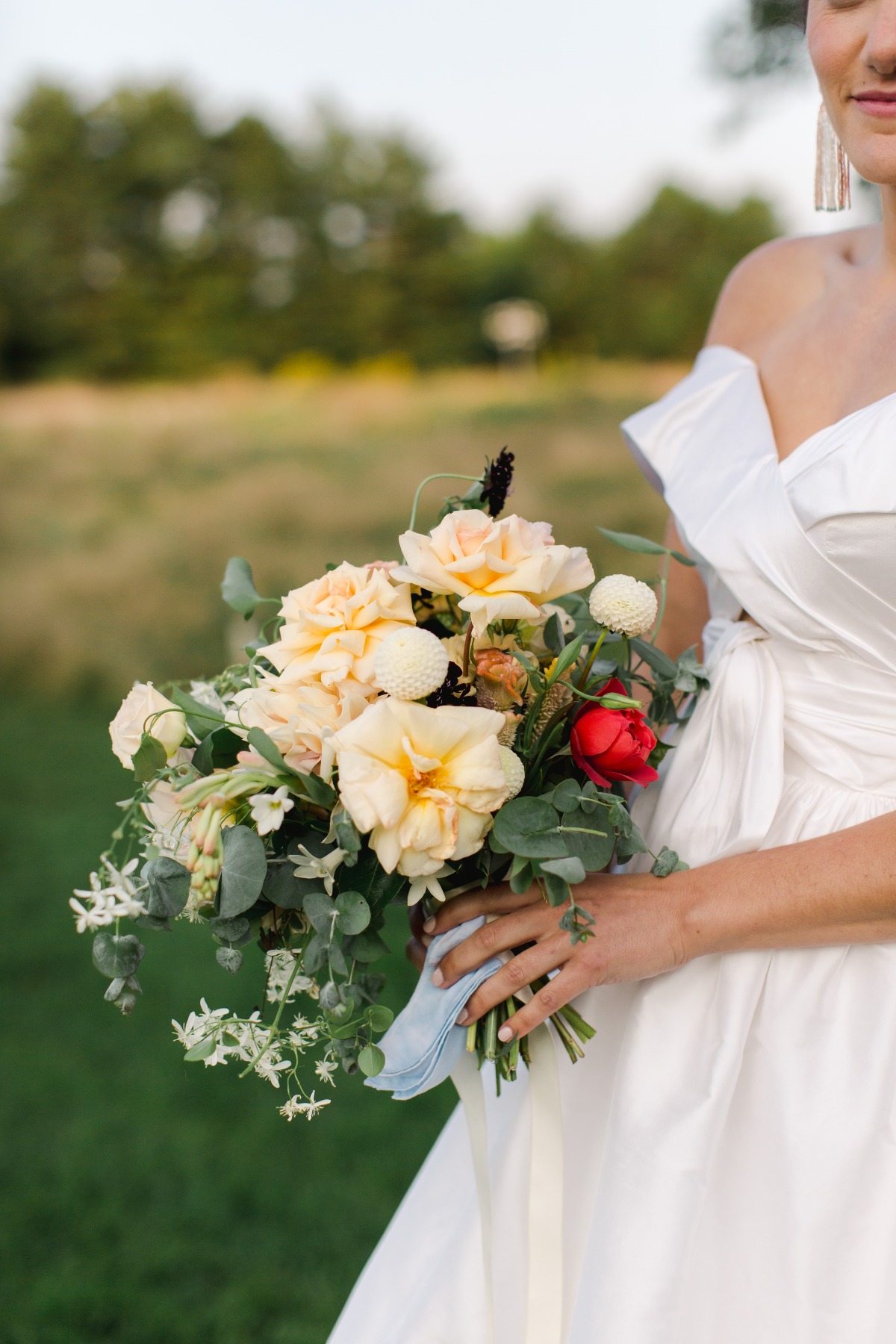 Close-up of bride holding wedding bouquet