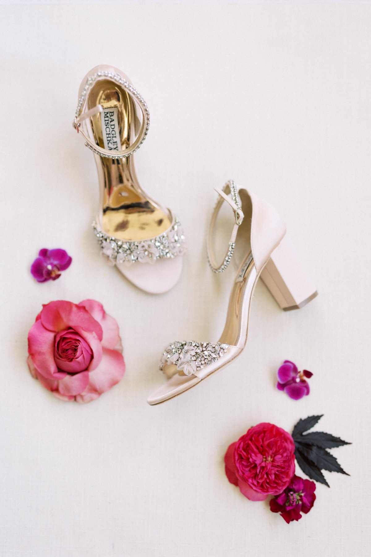 Aerial photo of Badgley Mischka shoes with flowers
