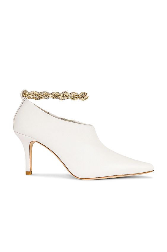 white leather booties with gold anklet