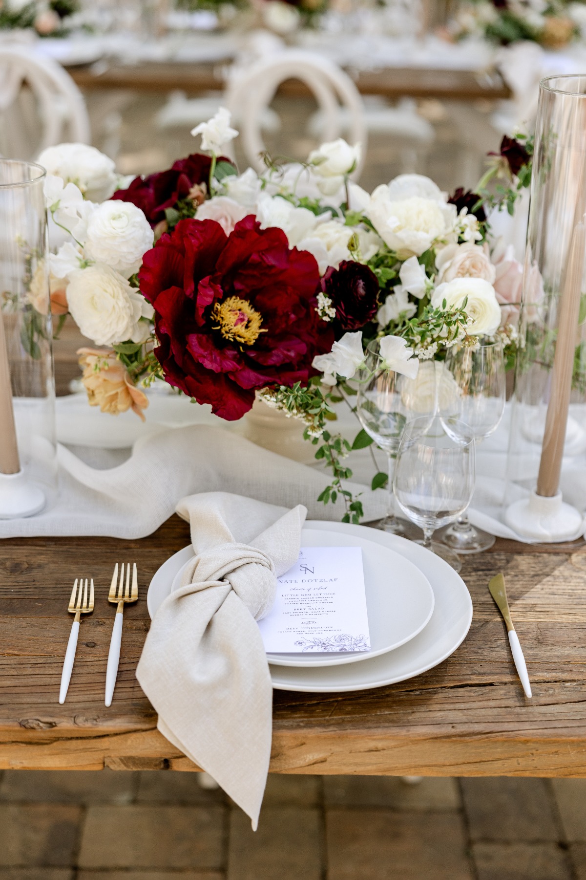 neutral wedding reception with pops of red