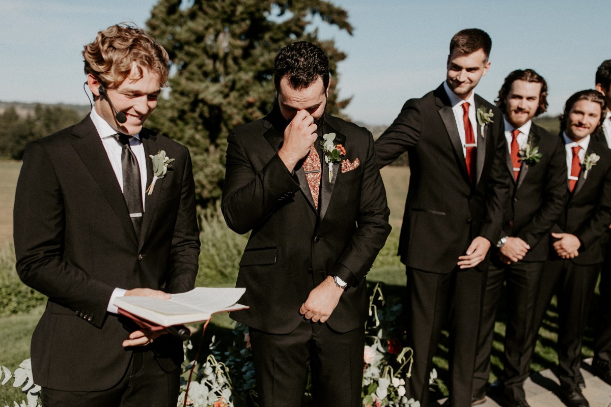 Candid photos of the groom crying