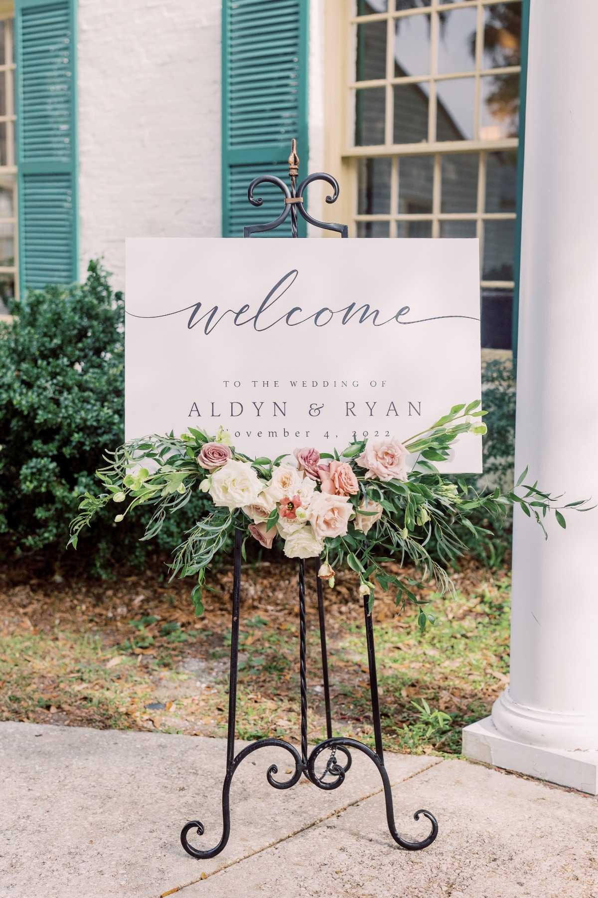 welcome sign with flower arrangement
