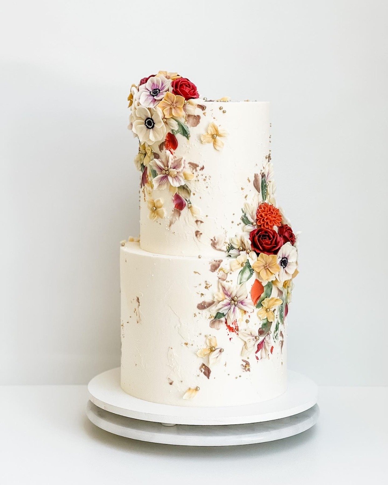 vibrant floral wedding cake with fall flowers