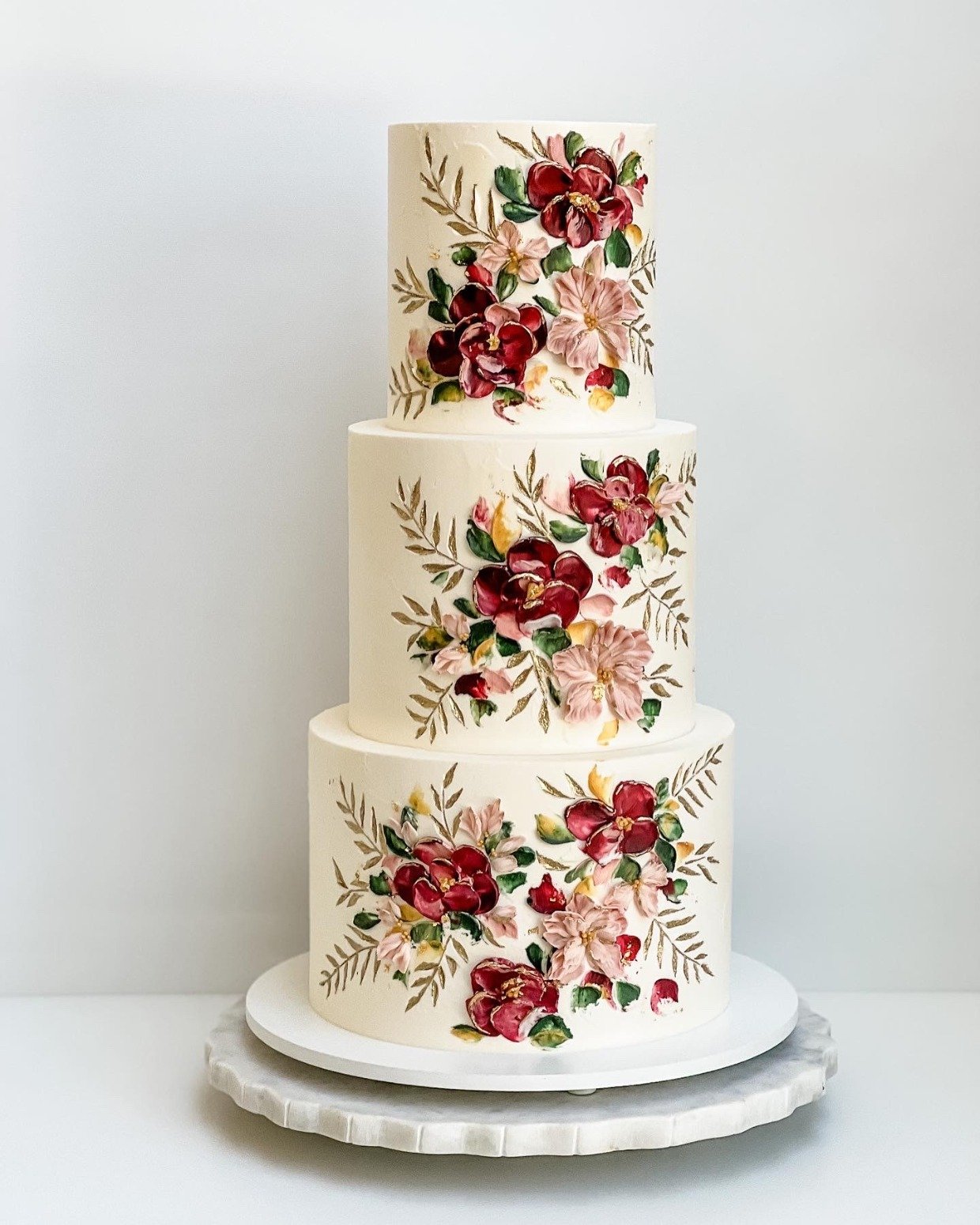 floral fall wedding cake with painted flowers in burgundy