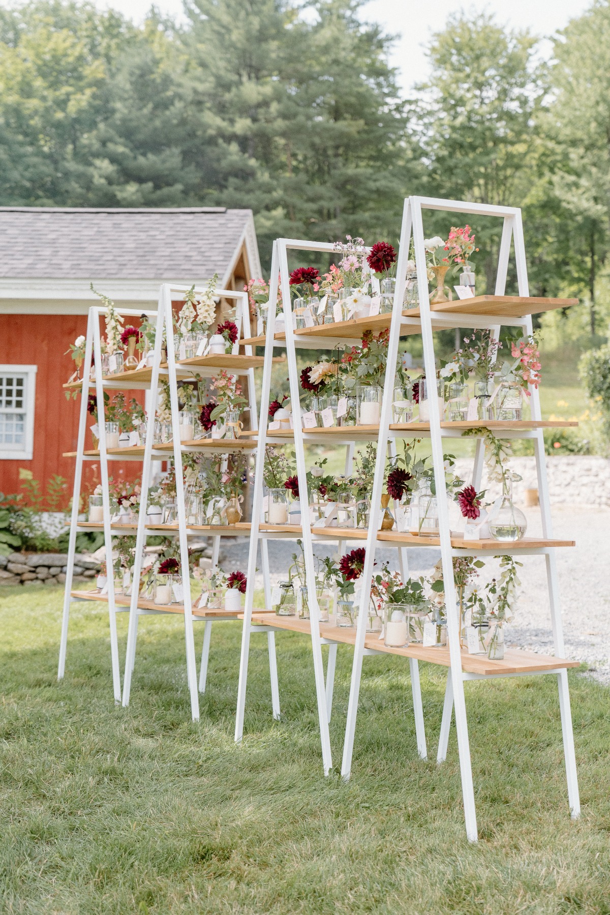 Ladder shelving with flower vase arrangements outside
