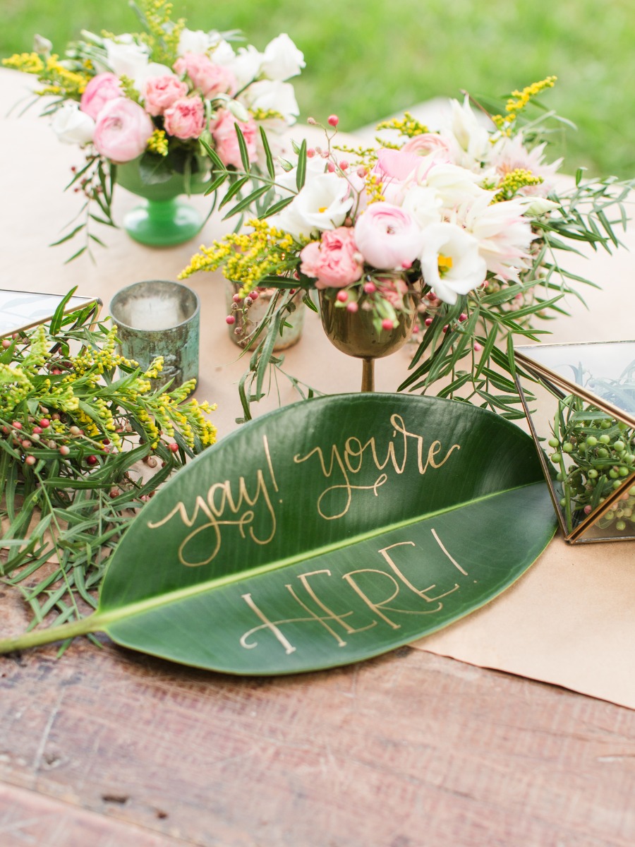 Floral arrangement with Yay youre here leaf sign