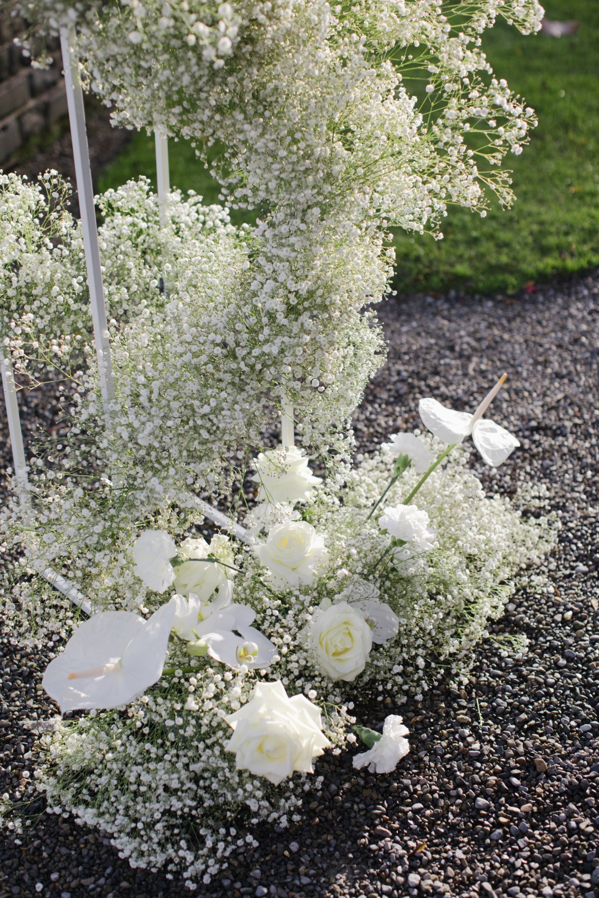 Classic all white ceremony flowers