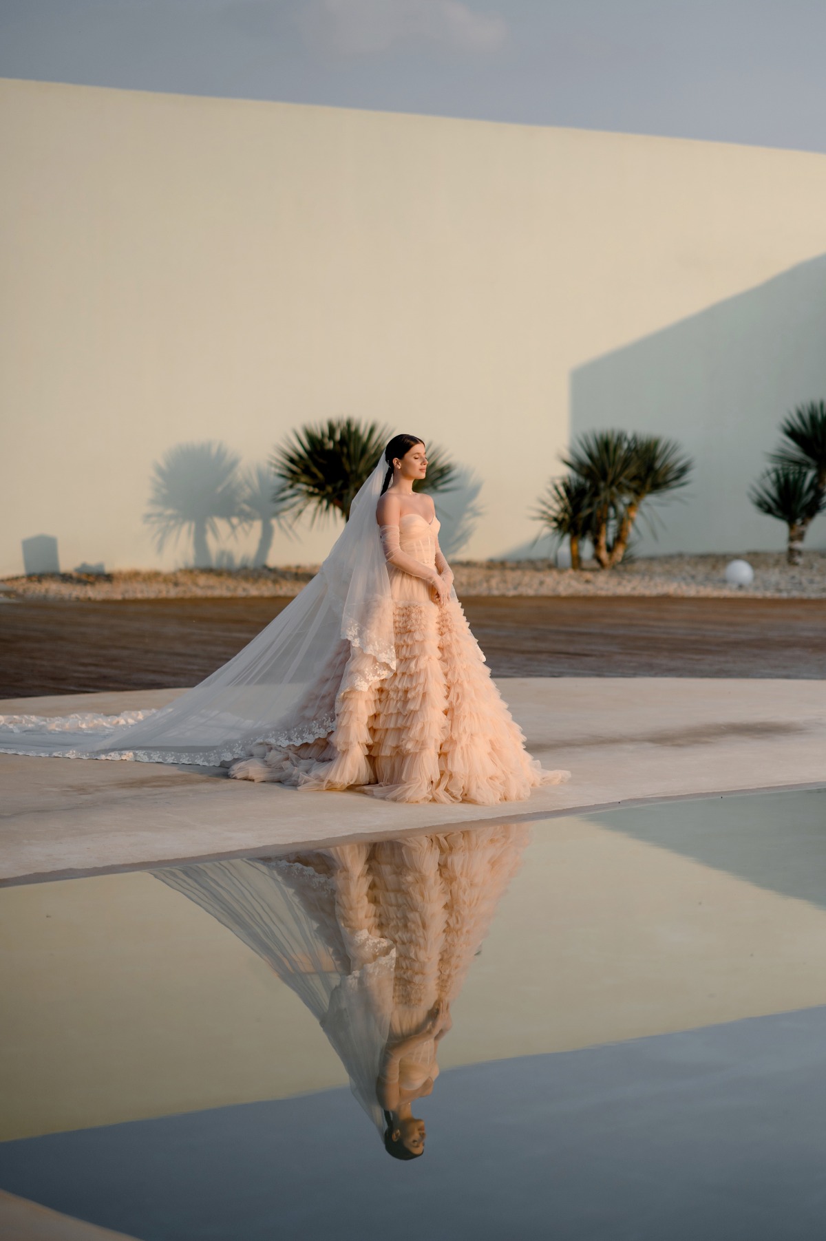 bride in custom peach wedding dress