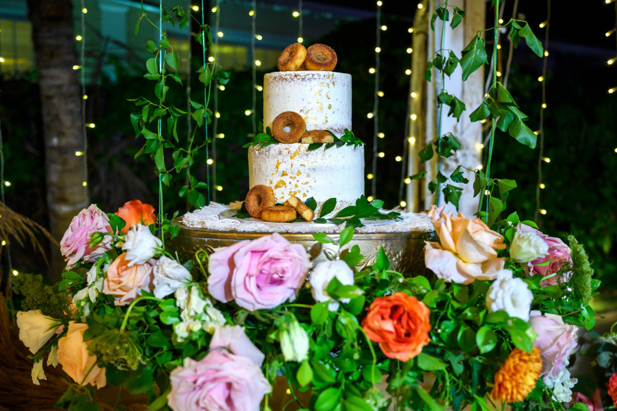 Naked wedding cake with backrop