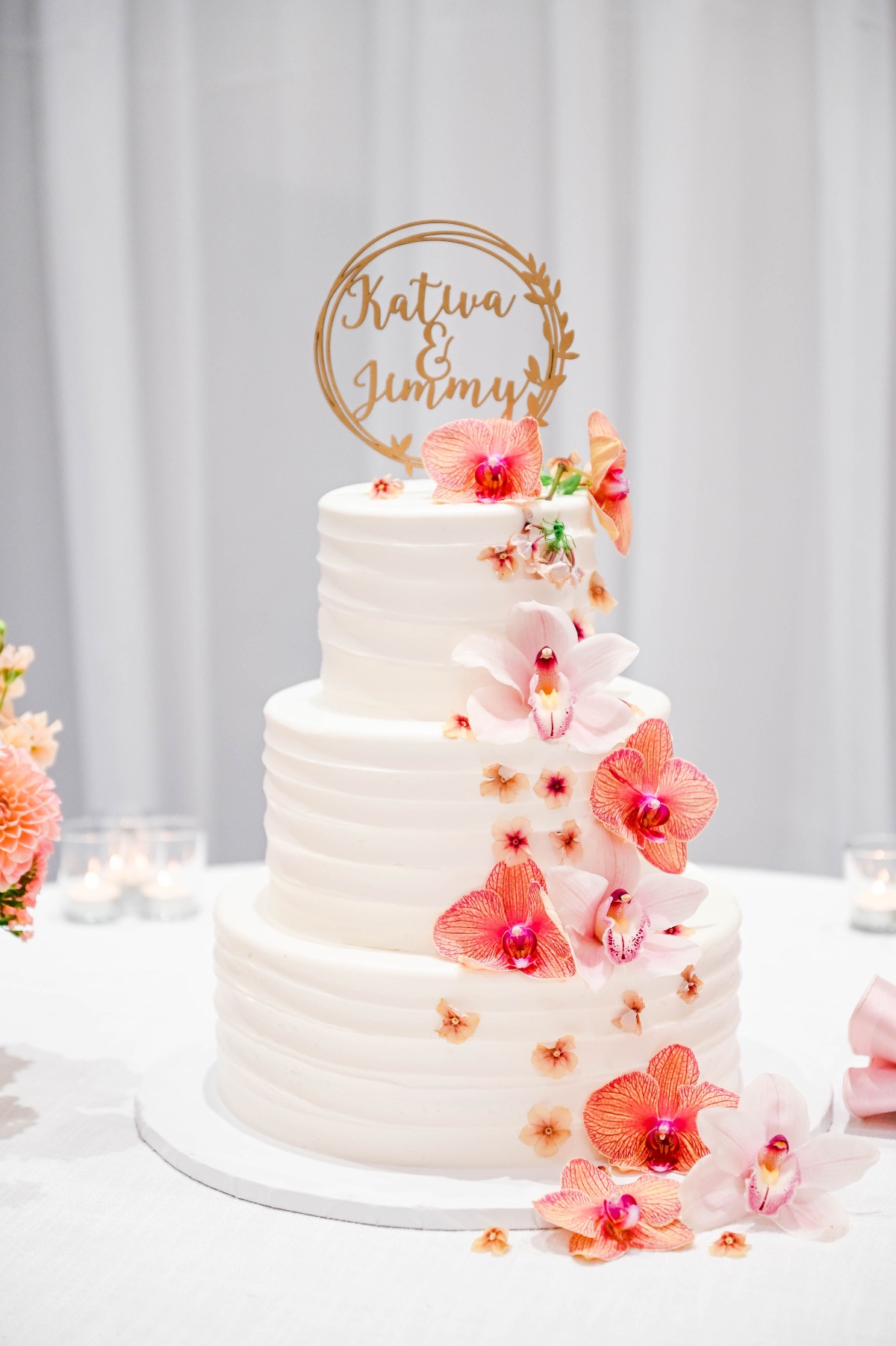 wedding cake adorned with orchids