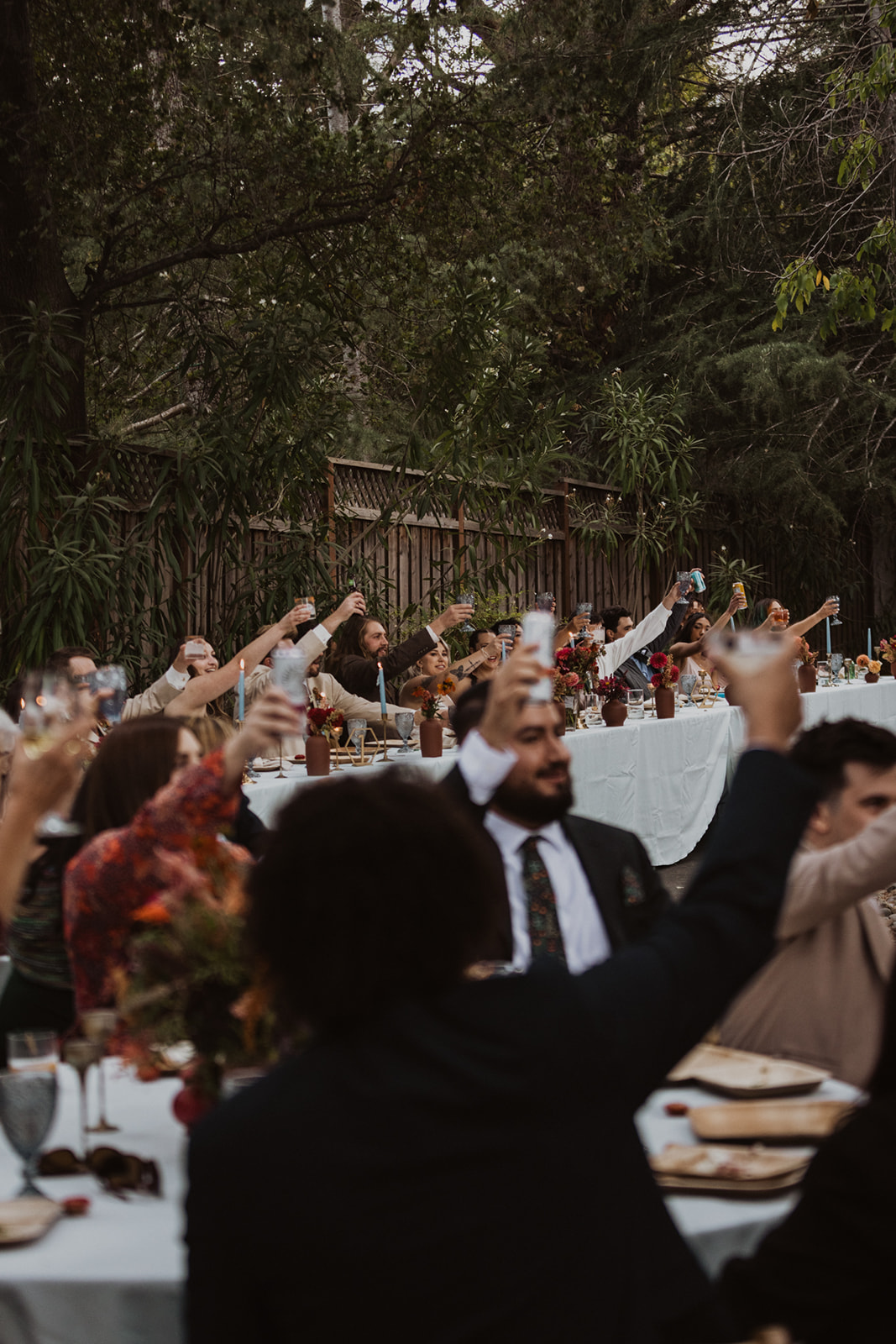 group cheers photo at wedding